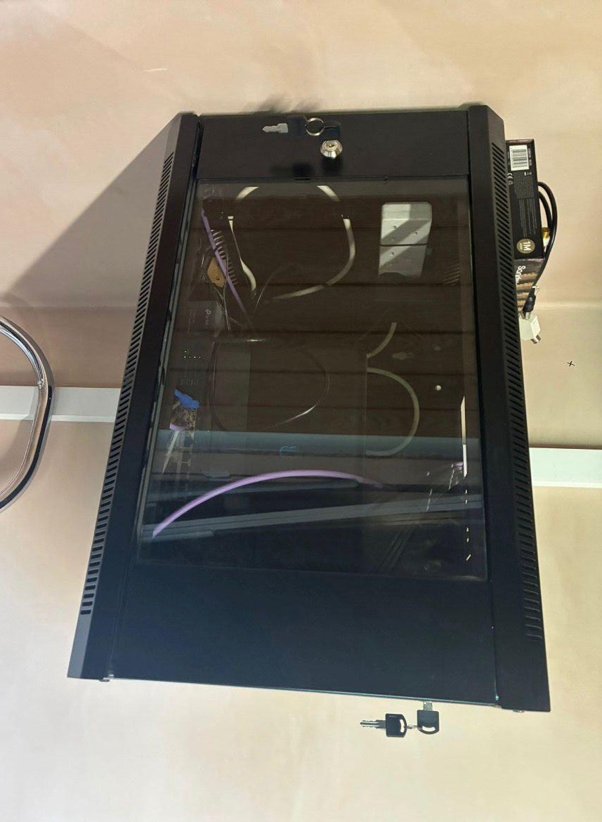Wall mounted comms cabinet with structured data cabling