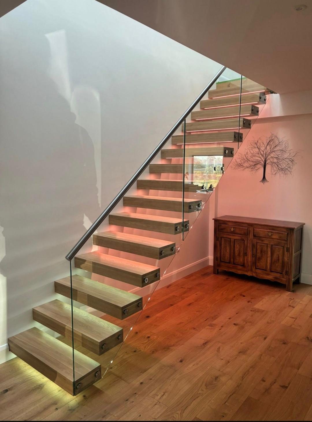 Floating oak staircase with feature LED lighting to each tread